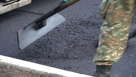 Workers pave the asphalt Stock Footage 115330221