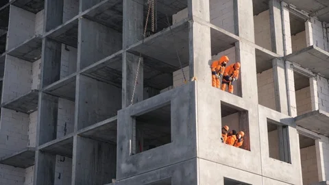 Workers perform job building elite house using panels Stock Footage 124607942