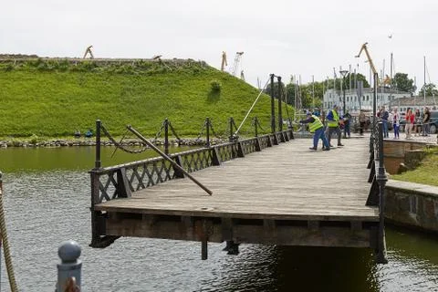 Workers perform manually turn of wrought in Klaipeda Lithuania Stock Photos