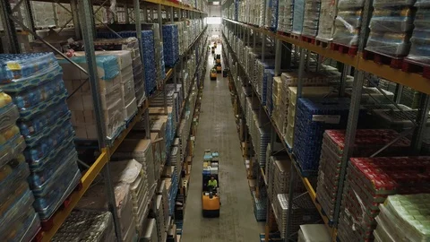 Workers picking an isle in large warehouse, drone aerial 4K Stock Footage 101200571