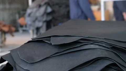 Workers Piling The Black Leather In A Tannery Factory In Ethiopia, Africa. - Stock Footage 313042642