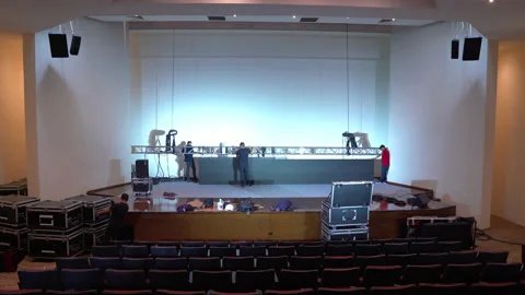 Workers place led video panels in an auditorium. Stock Footage 132084474