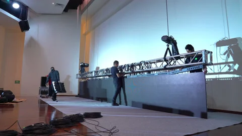 Workers place led video panels in an auditorium. Stock Footage 132084856