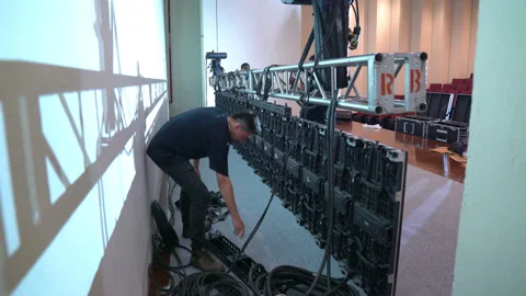 Workers place led video panels in an auditorium. Stock Footage 132091354