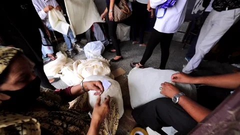 Workers in post office sew bags with parcels. Kathmandu, Nepal Stock Footage 74340842