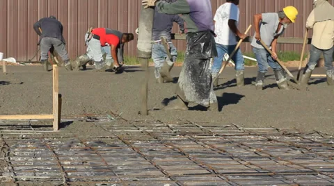 Workers Pour and Smooth Concrete Stock Footage 31241049