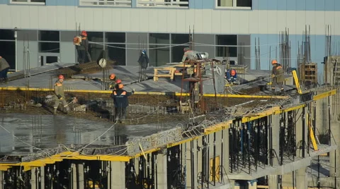 Workers pour concrete at the construction site Stock Footage 63010629
