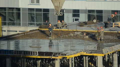 Workers pour concrete at the construction site Stock Footage 63010674