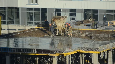 Workers pour concrete at the construction site Stock Footage 63010746