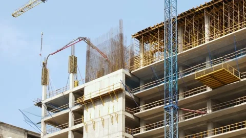 Workers pour concrete at the construction site of a new residential building. Stock Footage 237384848
