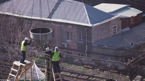 Workers Pour Concrete Into The Support Columns Stock Footage 168555898