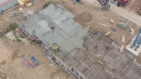 Workers pour the foundation with concrete view from above Stock Footage 159954816