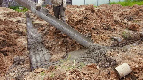 Workers poured cement Foundation Building a cottage Video stock 90399531