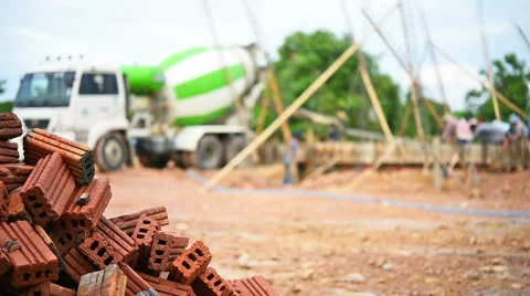 Workers pouring cement foundation for house building Stock Footage 64274542