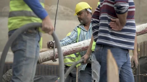 Workers pouring concrete Stock Footage 152421380
