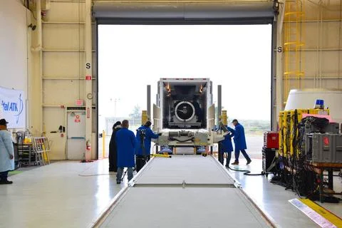 Workers prepare to offload the second and third stages of the Orbital ATK ... 스톡 사진