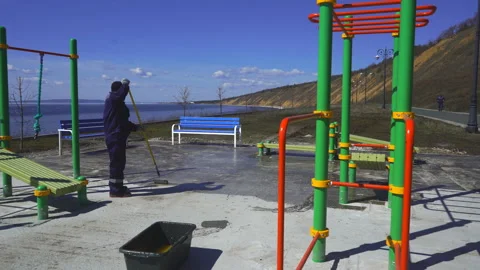 Workers prepare a Playground for rubber coating Stock Footage 91728119