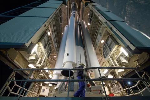 Workers prepare the United Launch Alliance (ULA) Delta II rocket, with the .. Stock Photos