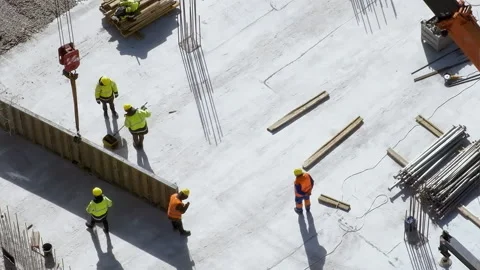 Workers preparing and painting a slab at the construction site Stock Footage 236473115