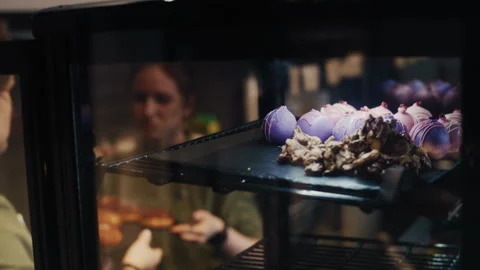 Workers Preparing Bakery Display with Sweet Pastries Video stock 313345358