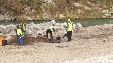 Workers Preparing Explosive Charge for Bridge Demolition Stock Footage 342019062