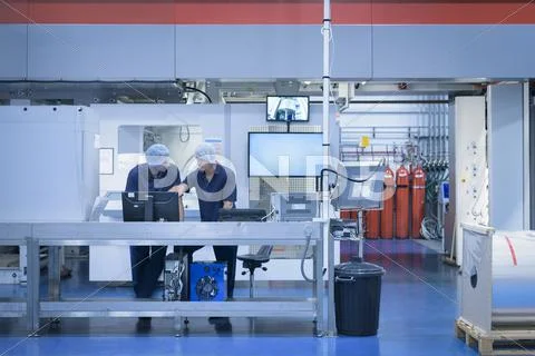 Workers With Printing Machine In Food Packaging Printing Factory ...