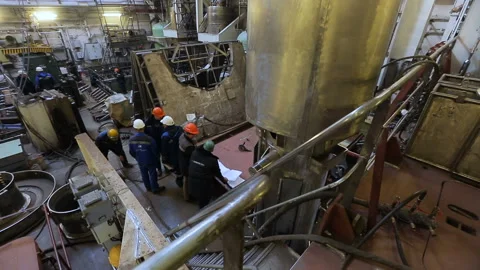 Workers in the process of discussing the working process on the ship. A lot of Video stock 92625836