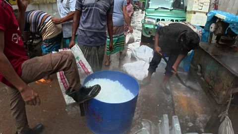 Workers Processing Crushed Ice at Kawran Bazar Market in Dhaka, Banglades Stock-Footage 343154919