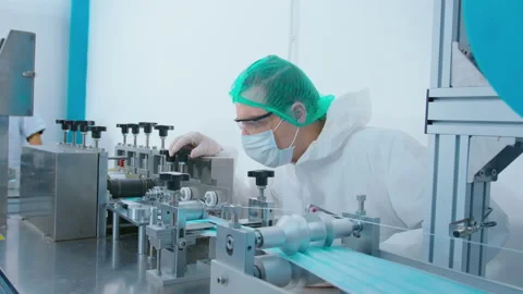 Workers producing surgical mask in modern factory, Covid-19 protection and me Vídeo Stock 158175588
