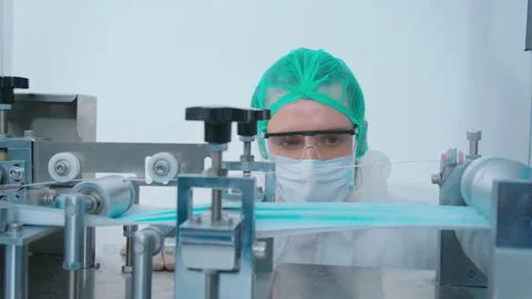 Workers producing surgical mask in modern factory, Covid-19 protection and me Vídeo Stock 158175650