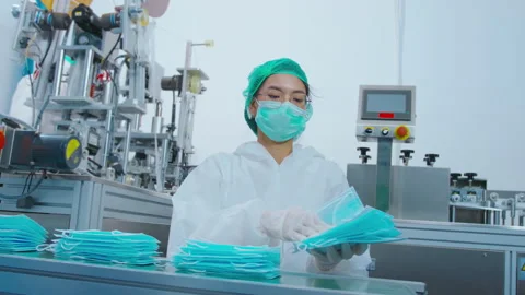Workers producing surgical mask in modern factory, Covid-19 protection and me Видео 158175861
