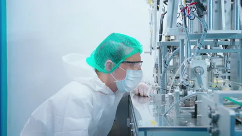 Workers producing surgical mask in modern factory, Covid-19 protection and me 動画素材 158175942