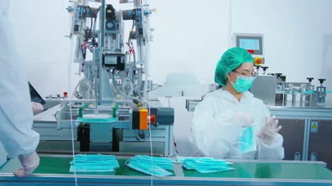 Workers producing surgical mask in modern factory, Covid-19 protection and me Видео 158176305