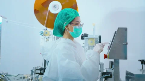 Workers producing surgical mask in modern factory, Covid-19 protection and me 動画素材 158176739