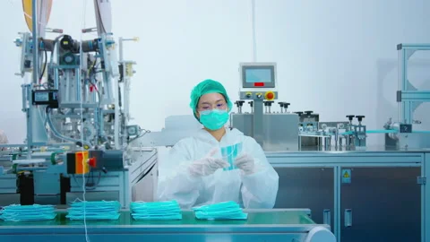 Workers producing surgical mask in modern factory, Covid-19 protection and me Видео 158176955