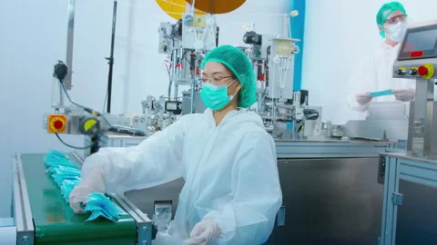 Workers producing surgical mask in modern factory, Covid-19 protection and me Видео 158176966