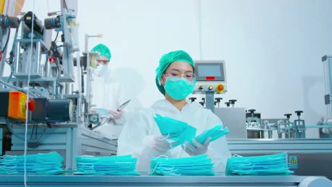 Workers producing surgical mask in modern factory, Covid-19 protection and me Видео 158177023