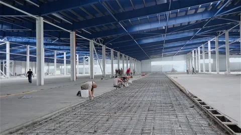Workers with professional equipment make a concrete floor, indoor. Concept of Video stock 320939145