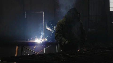 Workers with protective mask welding metal Stock Footage 105026527