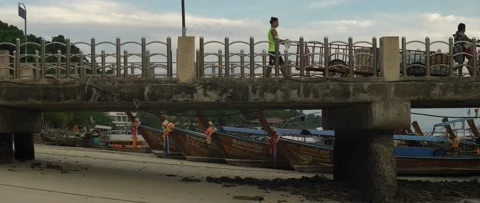 Workers push carts across an empty pier Stock Footage 232855006