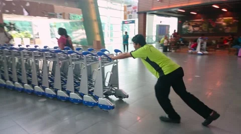 Workers Pushing Trolleys At KLIA2 스톡 동영상 53410761