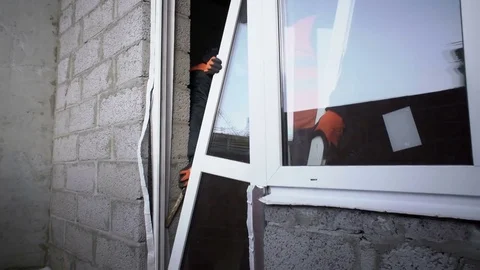 Workers put the door in the opening Stock Footage 82301918