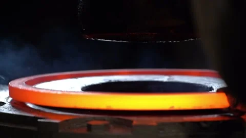 Workers put the workpiece on a Metal press to stretch the hot metal and fit it Video stock 143320356