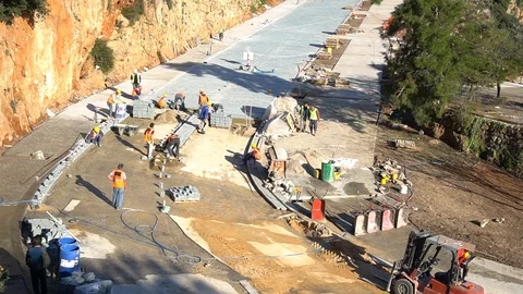 Workers puts sidewalk tile close up Time Lapse Stock Footage 87812154