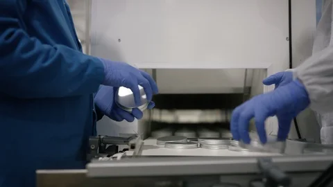 Workers putting lid on cosmetic boxes in factory Video stock 107995184