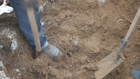 Workers on a rack digging up a cable of communication Stock Footage 99892489