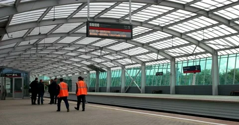 Workers railway workers in orange vests are on the platform Stock Footage 67467912