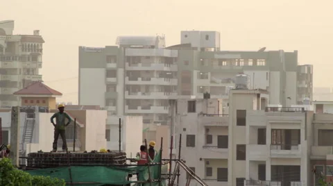 Workers at a Rapid Metro construction site, part of Delhi Metro, Gurgaon Stock Footage 49796951