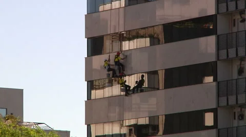 Workers Rappelling And Washing Windows on Building in Brazil Close shot 스톡 동영상 60648992