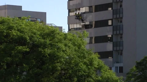 Workers Rappelling And Washing Windows on Building in Brazil  Stock-Footage 60649260